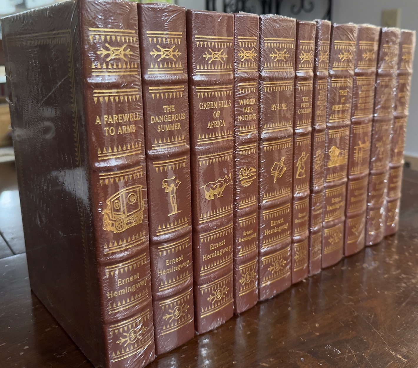 11 Volume Set of Ernest Hemingway Books: A Farewell to Arms / Green Hills of Africa / The Torrents of Spring / True at First Light / A Moveable Feast / By-Line / The Fifth Column / Across the River and Into the Woods / The Garden of Eden / Winner Take Nothing / The Dangerous Summer